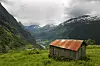 Utsyn frå Ørnevegen mot Geiranger og fjella der Tore Ørjasæter kom austanfrå og møtte «Vestland, Vestland».