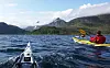 Loppa har det meste turinteresserte folk kan ønskje seg, skriv Harald Dag Jølle. Her padlar han saman med Vegard Ulvang og Stein P. Aasheim i godt driv over Langfjorden, på veg mot Sør-Tverrfjord.
