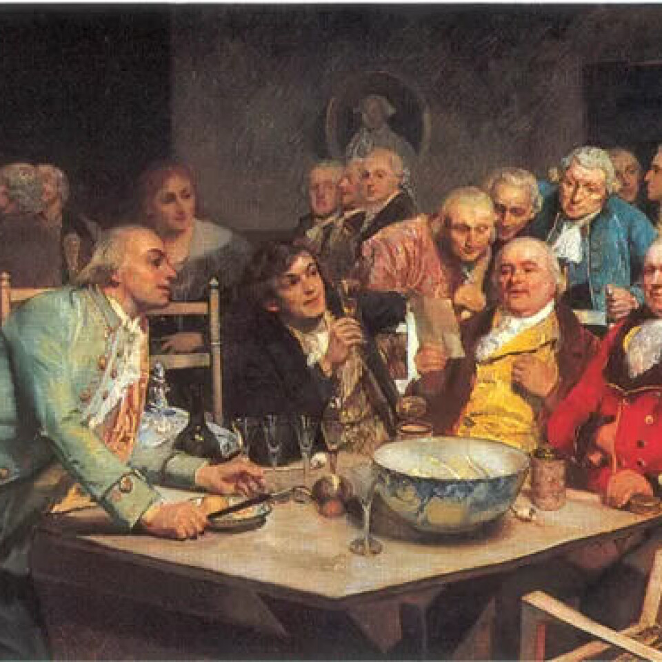 Eilif Peterssens (1852–1928) måleri «En Aften i Det norske Selskab» (1892). Mannen i grønt som lener seg så nonsjalant over bordet, er Claus Fasting.Eilif Peterssens (1852–1928) måleri «En Aften i Det norske Selskab» (1892). Mannen i grønt som lener seg så nonsjalant over bordet, er Claus Fasting. Eilif Peterssens (1852–1928) måleri «En Aften i Det norske Selskab» (1892). Mannen i grønt som lener seg så nonsjalant over bordet, er Claus Fasting.