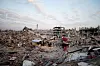 Palestinians gather among the rubble of buildings destroyed during the Israeli offensive, amid a ceasefire between Israel and Hamas, at Jabalia refugee camp, northern Gaza Strip, February 17, 2025. REUTERS/Mahmoud Issa REFILE - CORRECTING FROM 'AMONG RUBBLE OF DESTROYED BUILDINGS DURING THE ISRAELI OFFENSIVE' TO 'AMONG THE RUBBLE OF BUILDINGS DESTROYED DURING THE ISRAELI OFFENSIVE'.