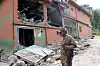 A Pakistan Army soldier stands in front of damaged Bilal Mosque after it was hit by an Indian strike in Muzaffarabad, the capital of Pakistan-administered Kashmir, May 7, 2025. REUTERS/Stringer