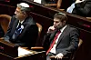 Far-right Israeli lawmakers Itamar Ben Gvir, center, and Bezalel Smotrich, right, attend the swearing-in ceremony for Israel's government, at the Knesset, or parliament, in Jerusalem, Tuesday, Nov. 15, 2022. (AP Photo/ Maya Alleruzzo, Pool)