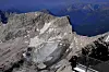 Tourists look at the Schneeferner Glacier below Germany's highest mountain Zugspitze near Garmisch-Partenkirchen, Germany, Tuesday, Aug. 15, 2023. (AP Photo/Matthias Schrader)