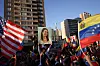 Caption: A person holds up an image depicting Venezuelan opposition leader Maria Corina Machado, as people celebrate after the U.S. struck Venezuela and captured its President Nicolas Maduro and his wife Cilia Flores, in Santiago, Chile January 3, 2026. REUTERS/Pablo Sanhueza TPX IMAGES OF THE DAY