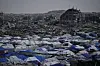 FILE - Tents sheltering displaced Palestinians stand amid the destruction left by the Israeli air and ground offensive in Gaza City Dec. 5, 2025. (AP Photo/Abdel Kareem Hana, File)