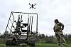 Ukrainian servicemen launch radio controlled and optic fibre controlled FPV-drones from an unmanned ground vehicle during testing at a training ground near a front line, amid Russia's attack on Ukraine, in Zaporizhzhia region, Ukraine April 10, 2026. REUTERS/Stringer