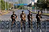 Police officers stand guard behind a barricade near Serena Hotel, as Pakistan prepares to host the U.S. and Iran for the second round of peace talks, in Islamabad, Pakistan, April 25, 2026. REUTERS/Asim Hafeezcha